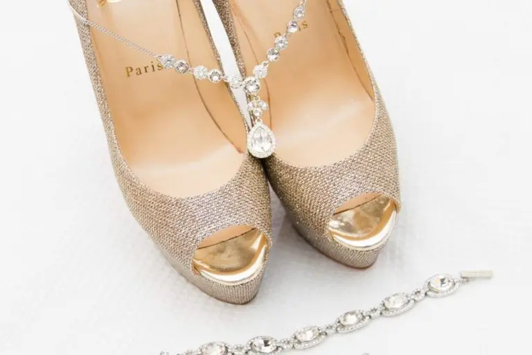 Elegant peep-toe high heels with a gold sparkle finish, paired with matching crystal jewelry—a necklace, bracelet, and earrings—perfect for a corporate event, all beautifully displayed on a white background.