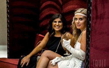 People smiling at camera during corporate event