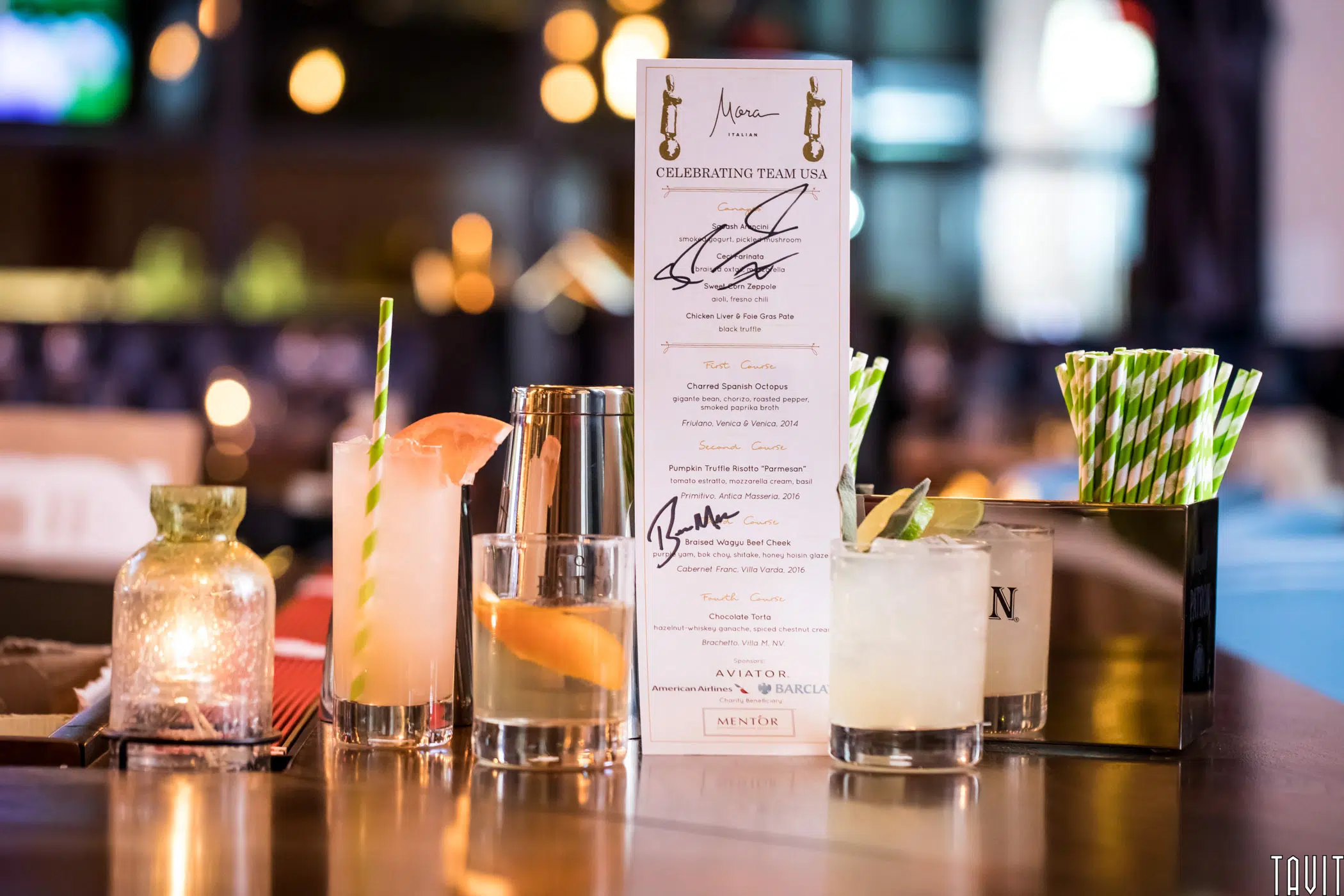 Bar with array of cocktails and menu