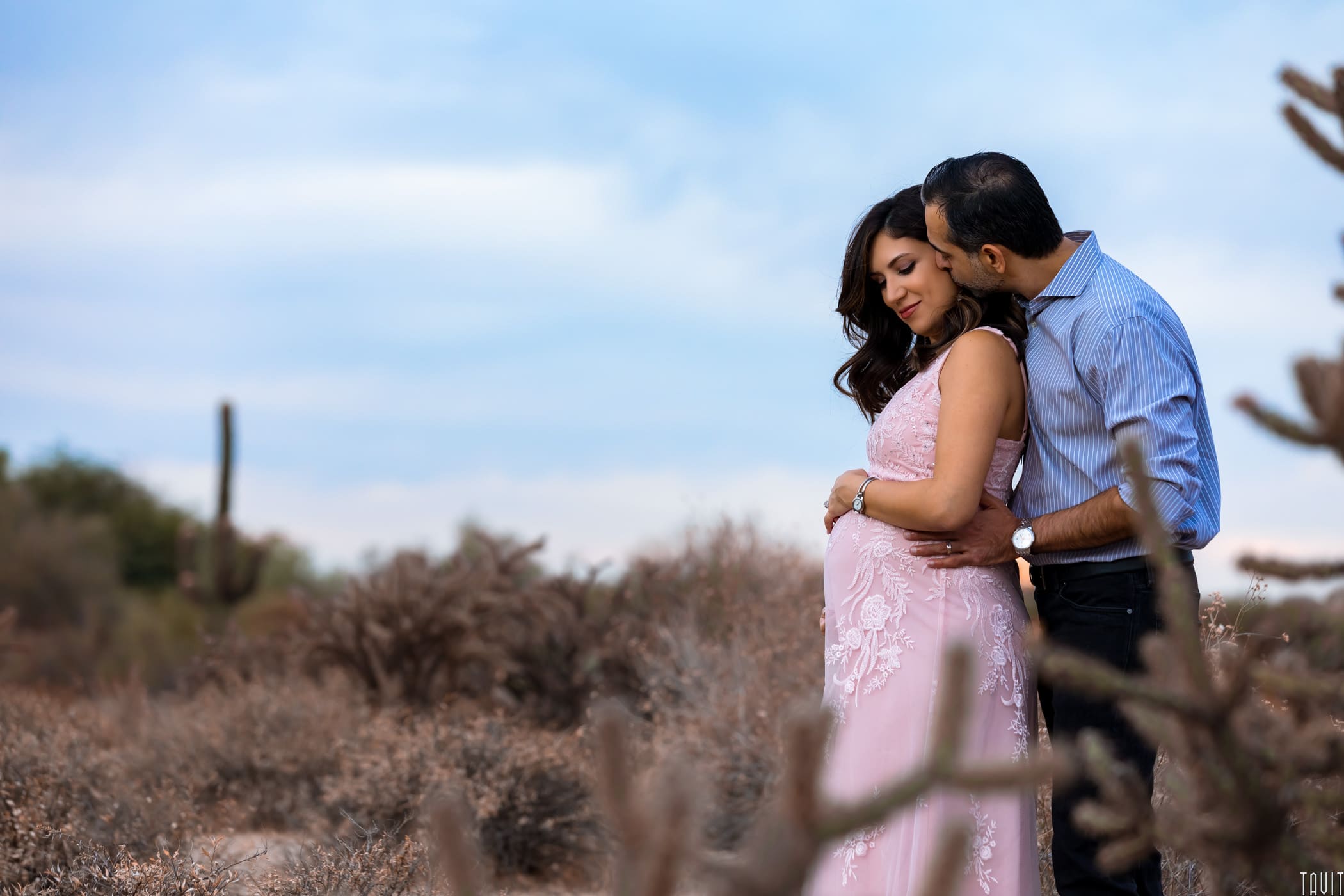 Couple together at outside maternity shoot