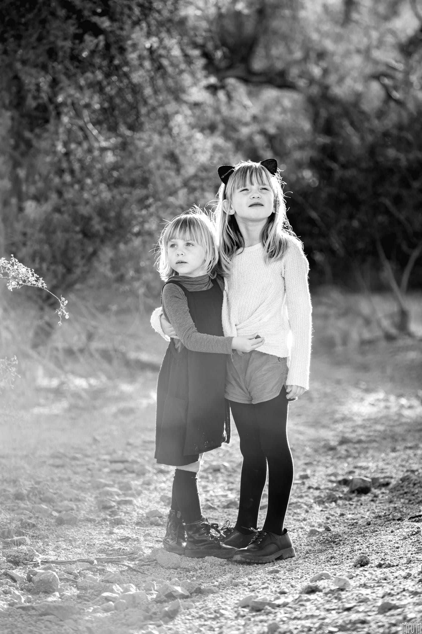 Black & White photo of sisters in the desert