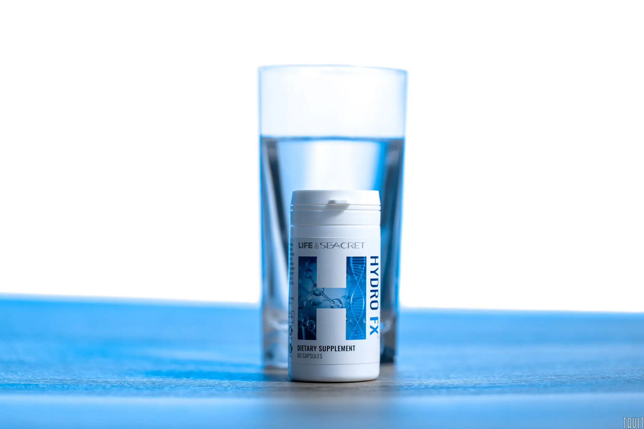 Hydro FX bottle in front of glass of water