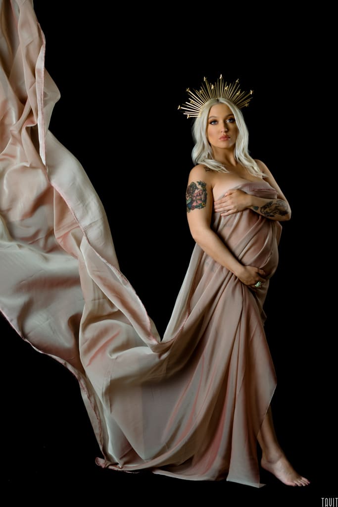Seductive pregnancy shot with long cloth flowing