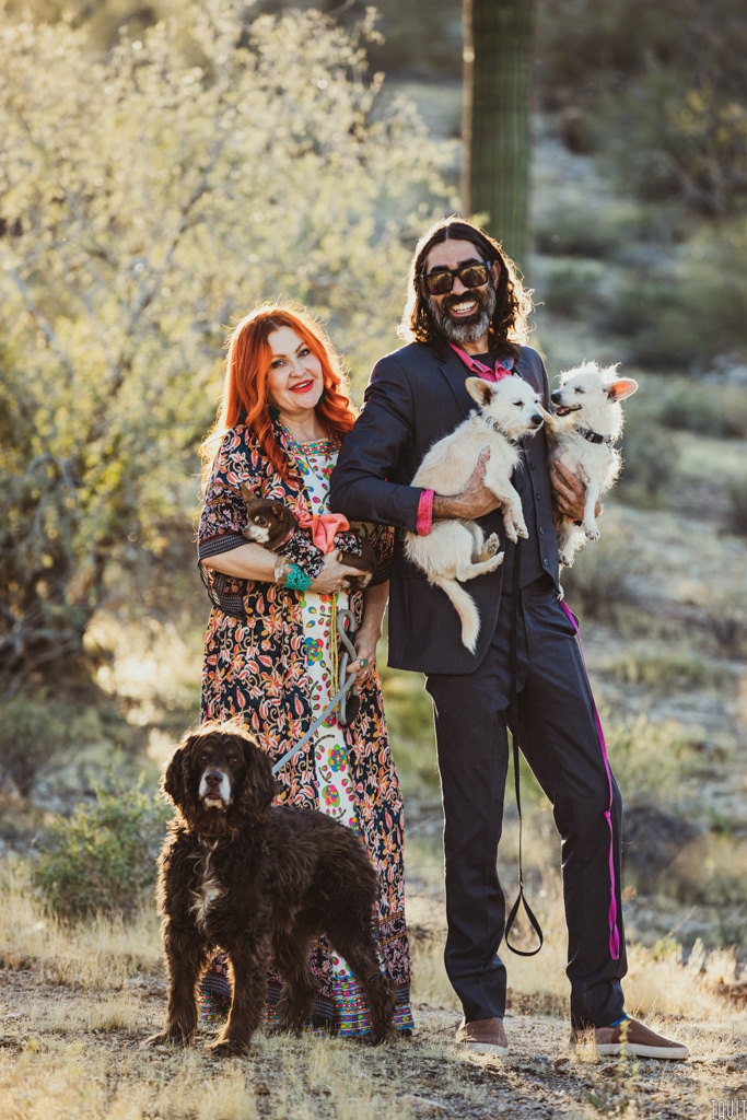 Picture of husband and wife with their four dogs