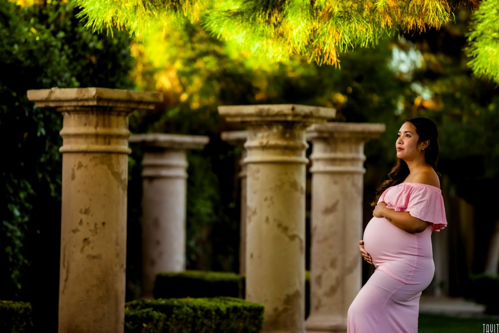 Woman in dress maternity shoot outside