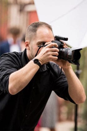 Tavit taking pictures at an event