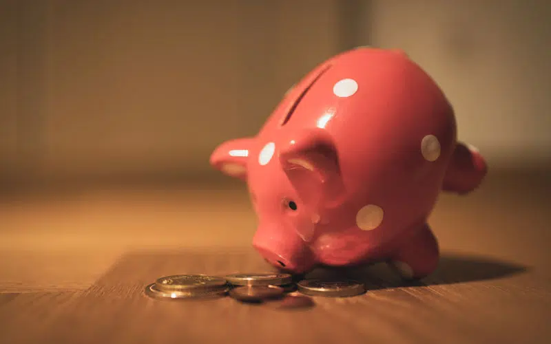 Piggy bank looking at coins