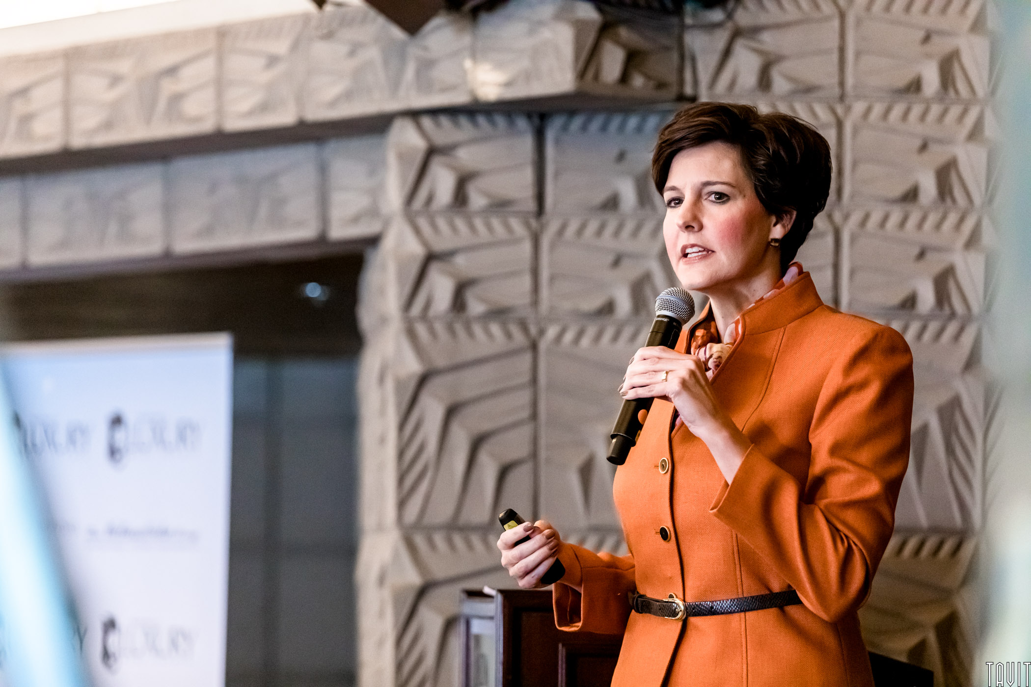 Woman giving speech for business event