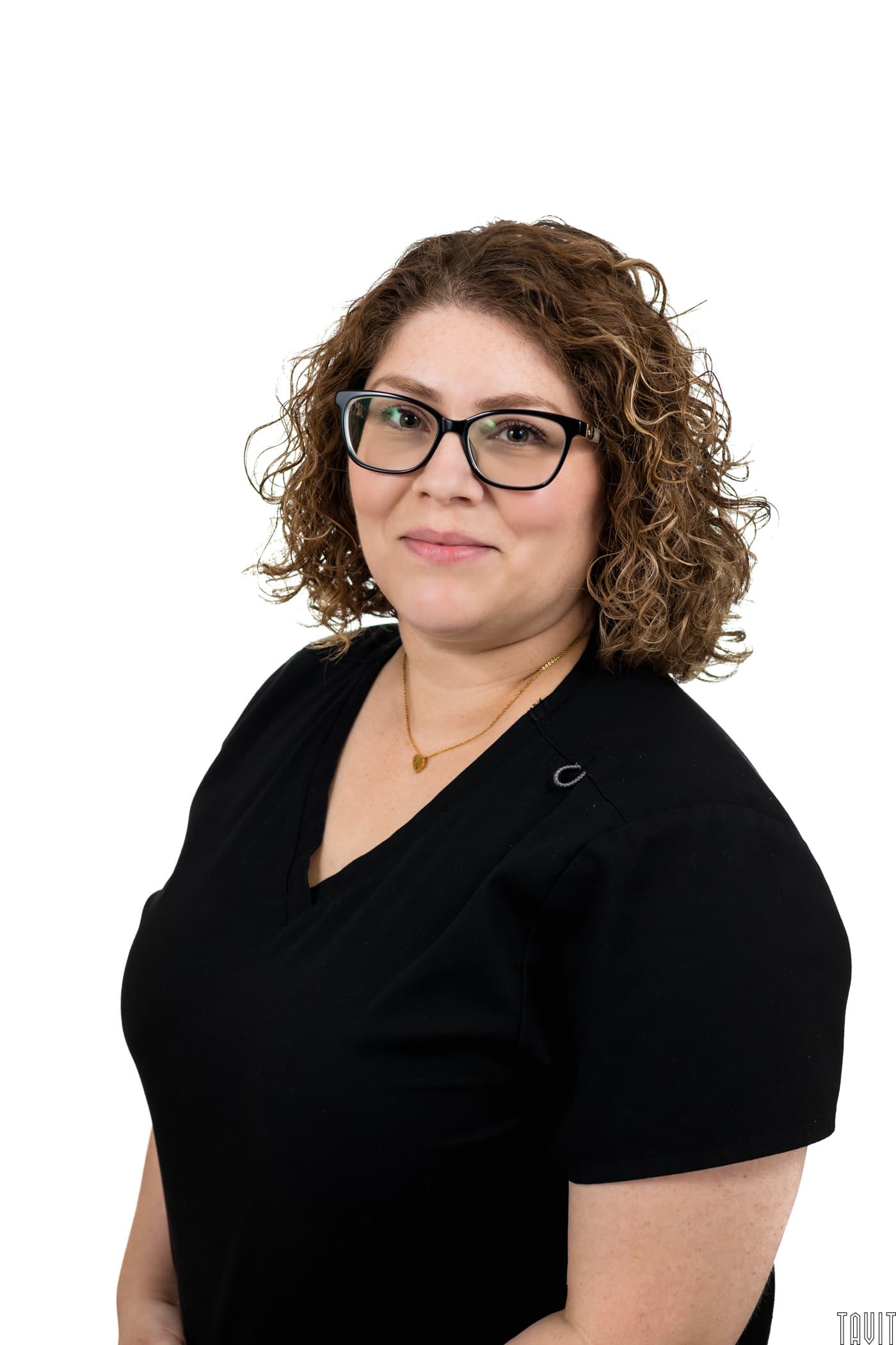 Woman in black shirt and glasses business headshot