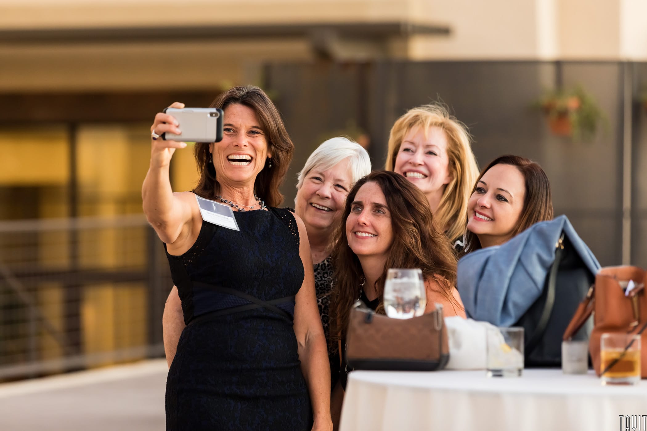 Group of people taking a picture at business event