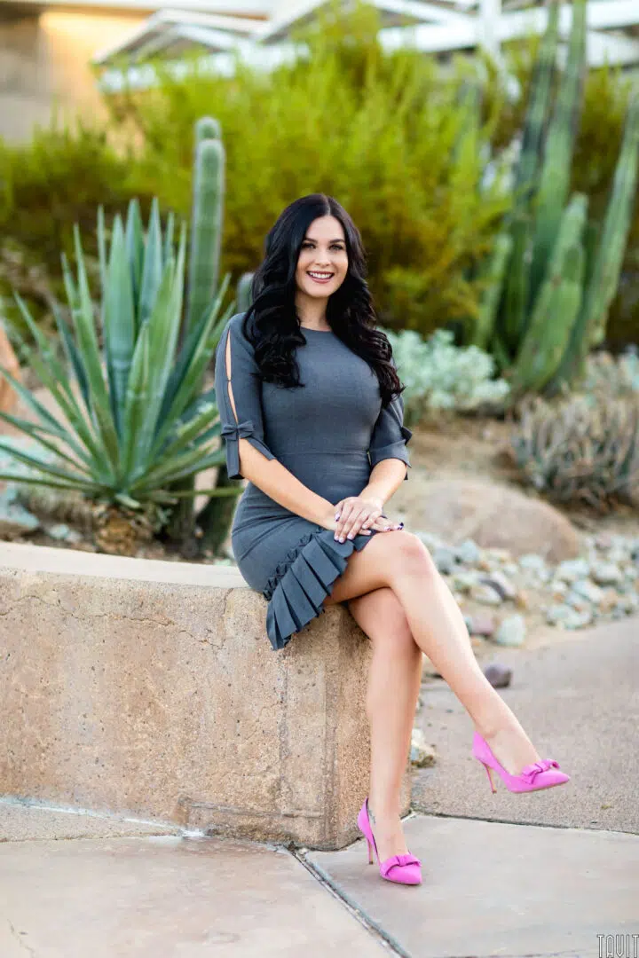 Woman sitting with desert plants headshot