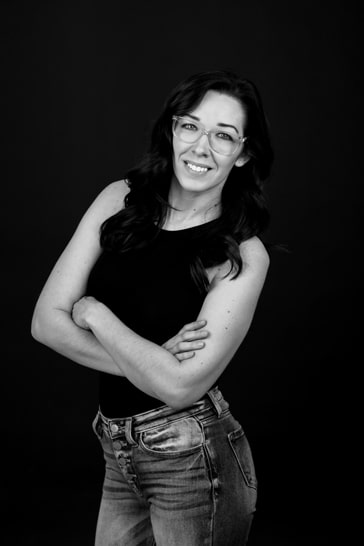Jennifer with arms crossed business headshot black and white