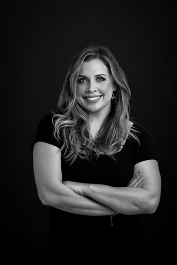 Woman with arms crossed business headshot black and white