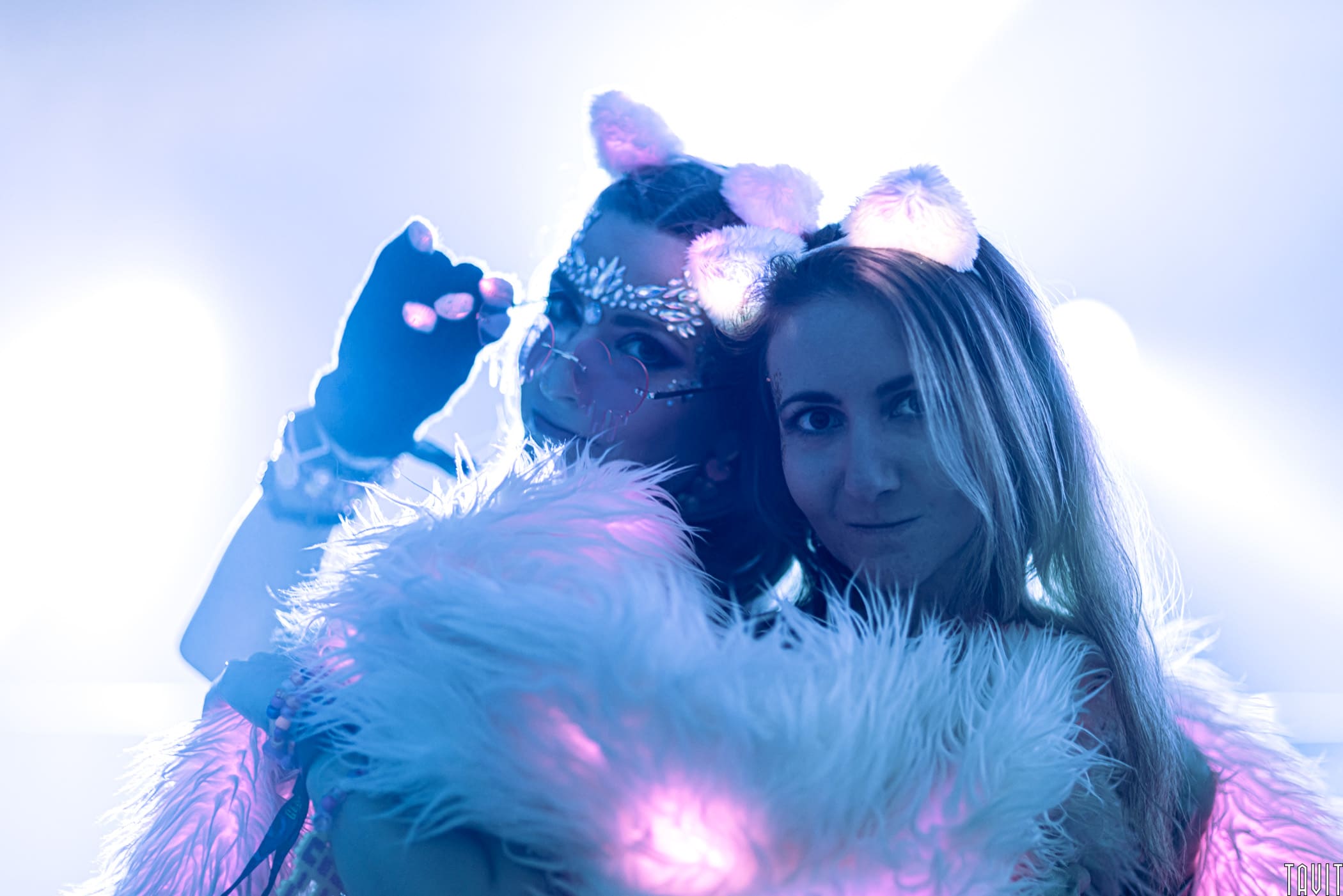 Two girls in light up cat ears at rave