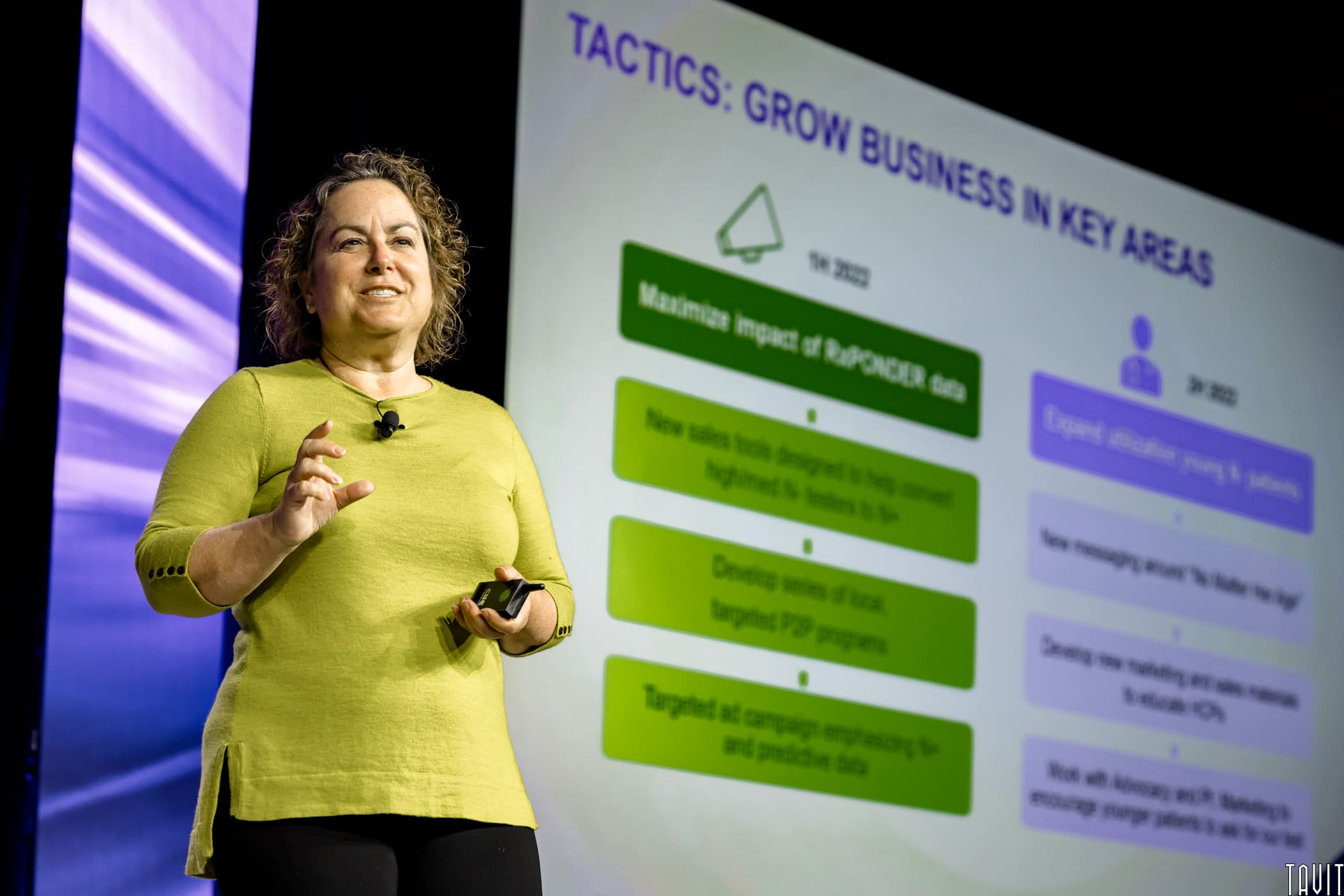 Woman giving business presentation on stage
