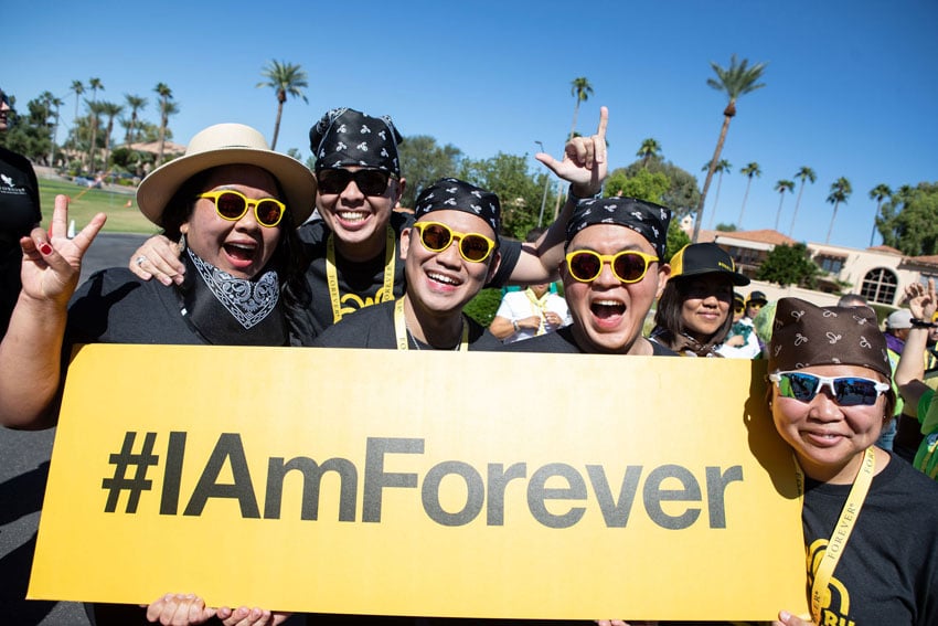 Group of people holding #I Am Forever sign