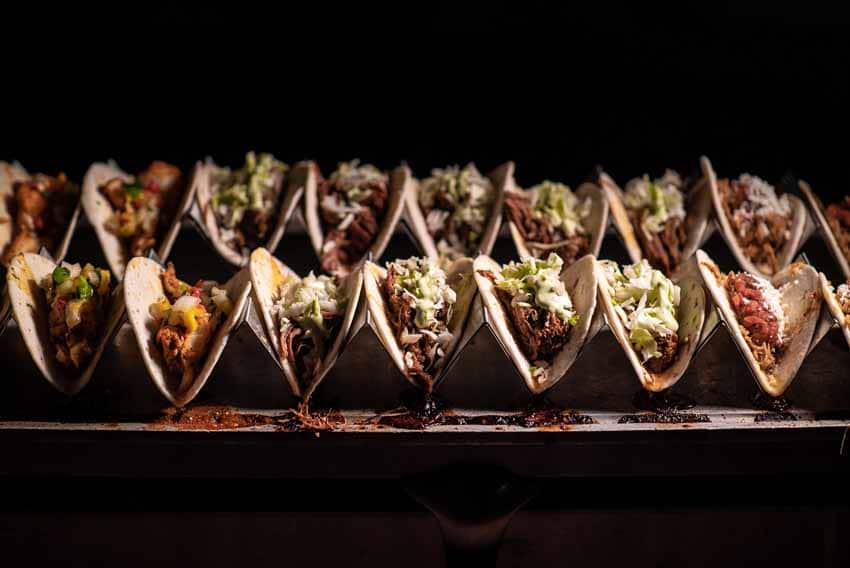 Two rows of tacos in taco holders