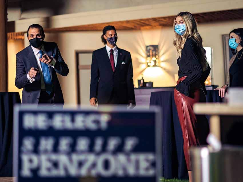Group of people in facemasks at election conference