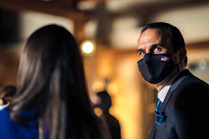 Man in suit with facemask