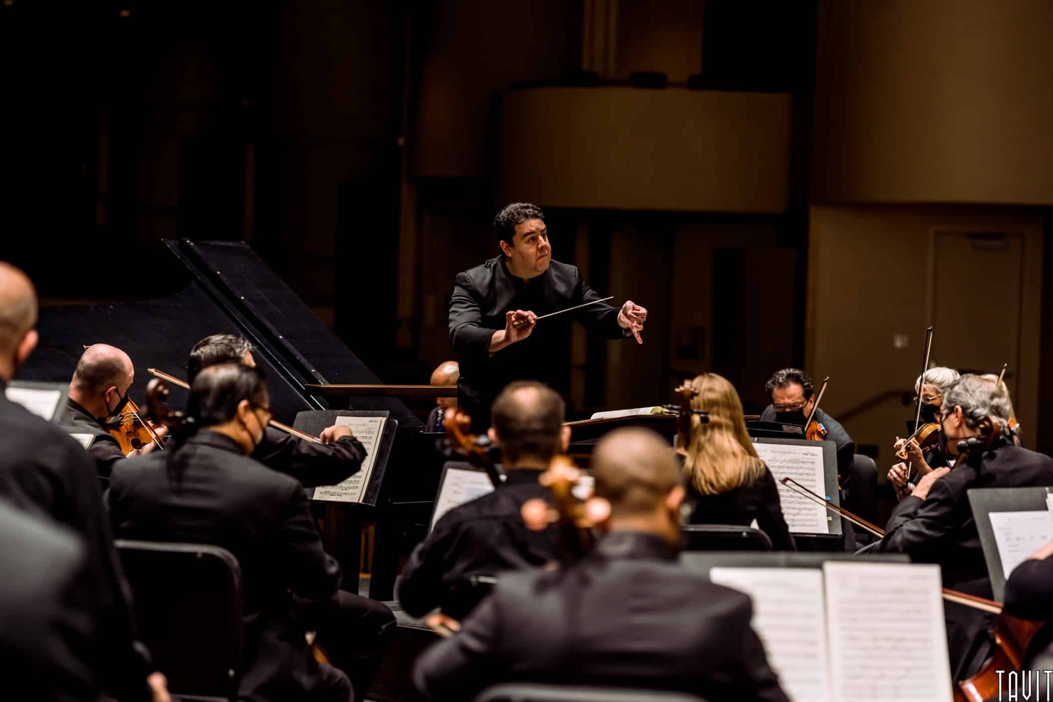 Conductor cueing in part of orchestra