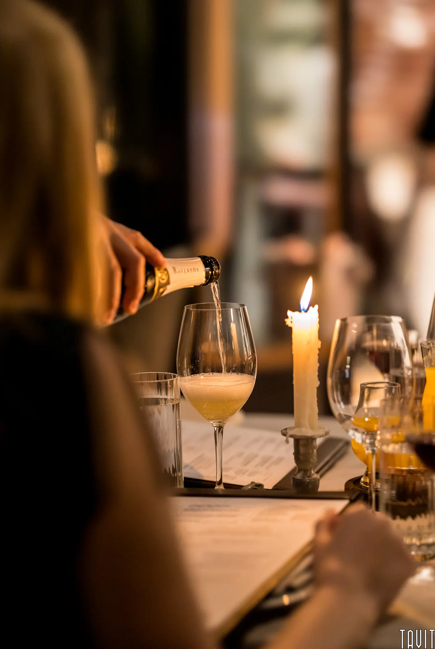 Pouring champagne at table
