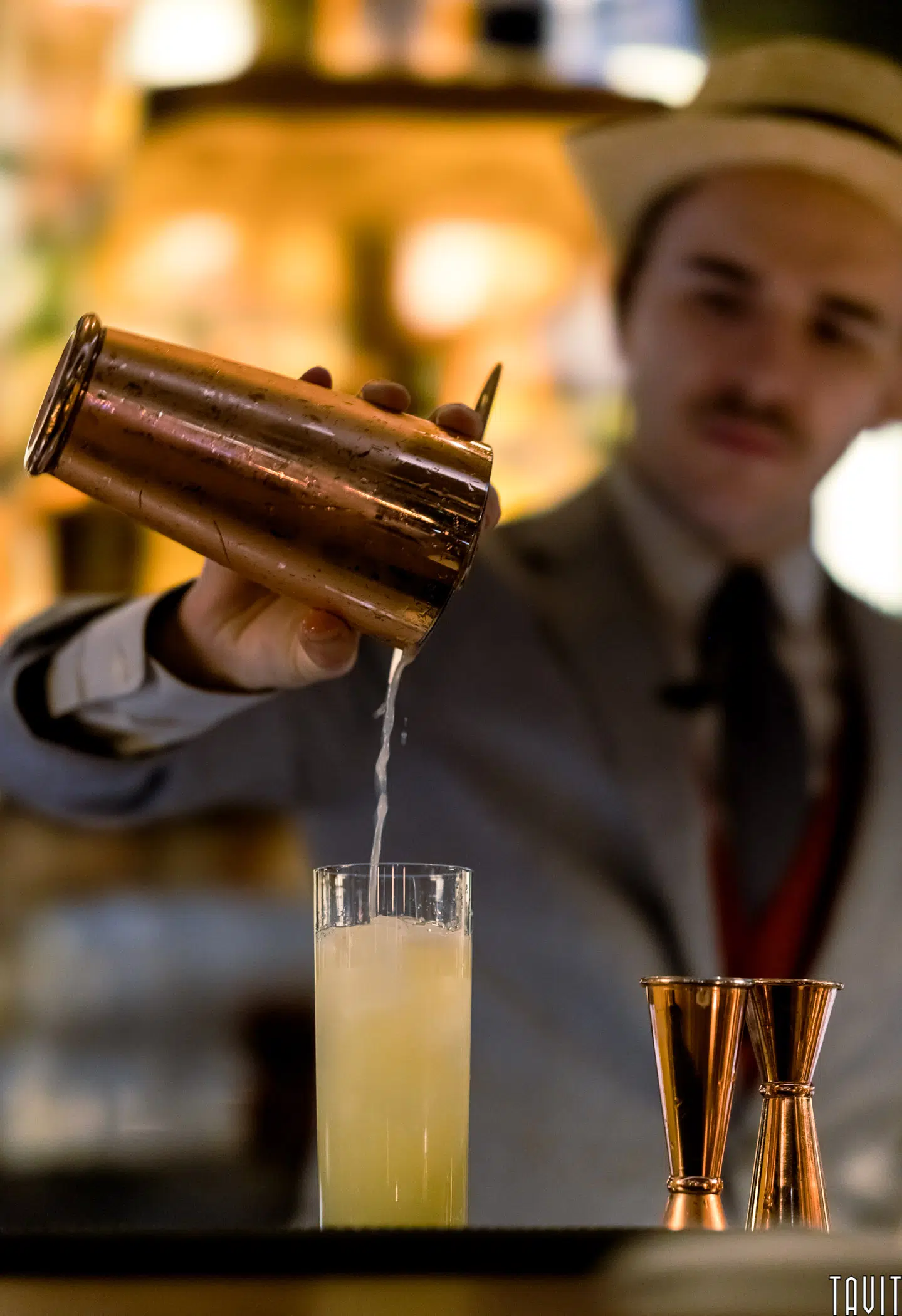 Bartender pouring cocktail
