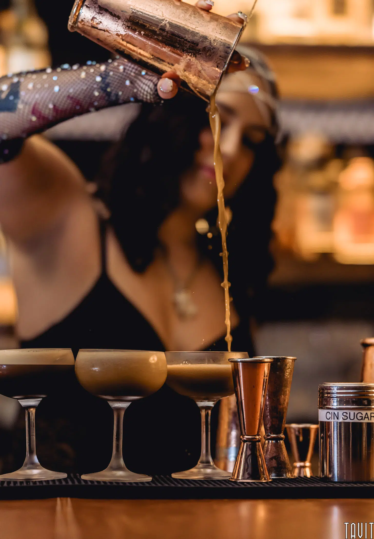 Bartender pouring cocktails