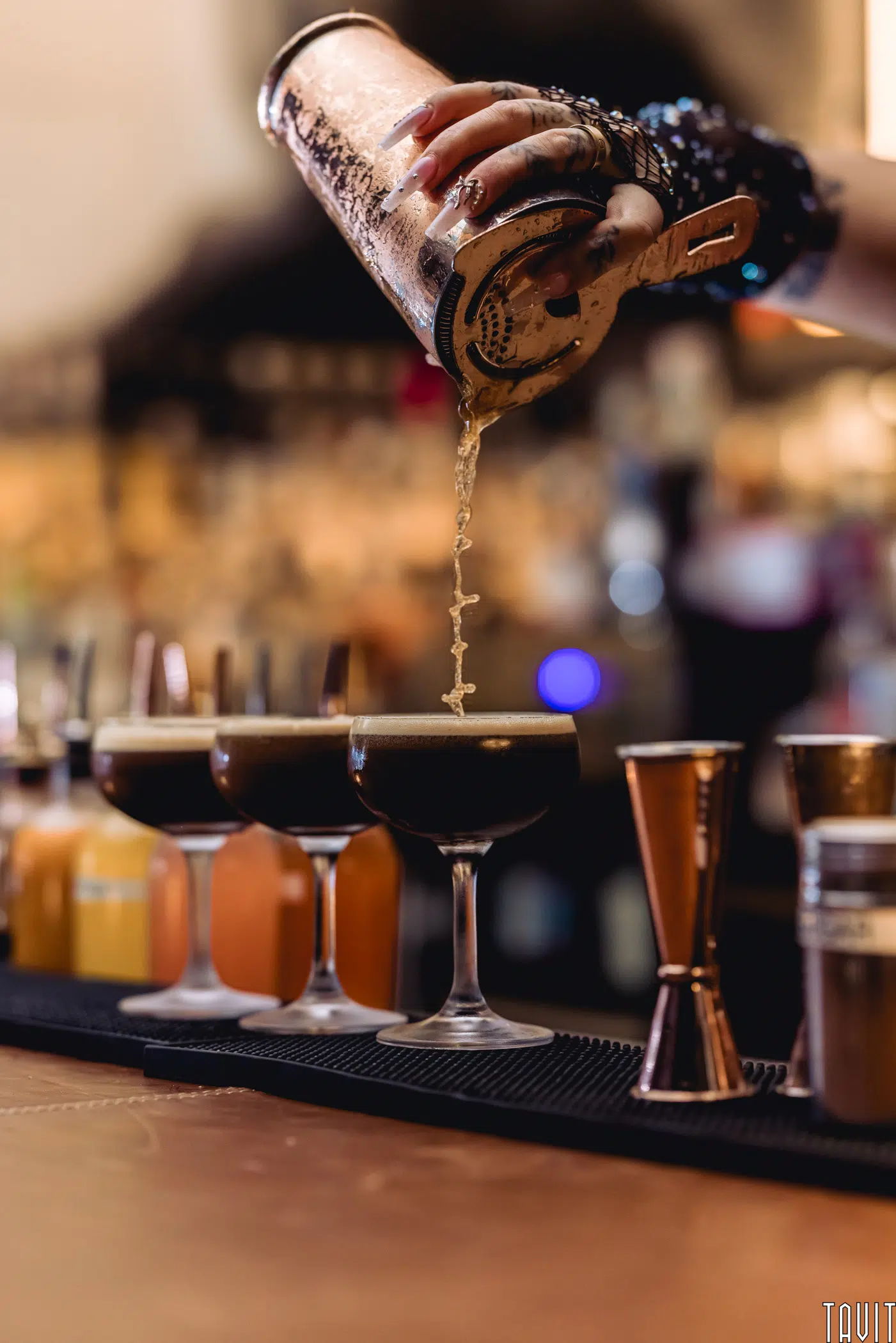 Bartender pouring cocktails