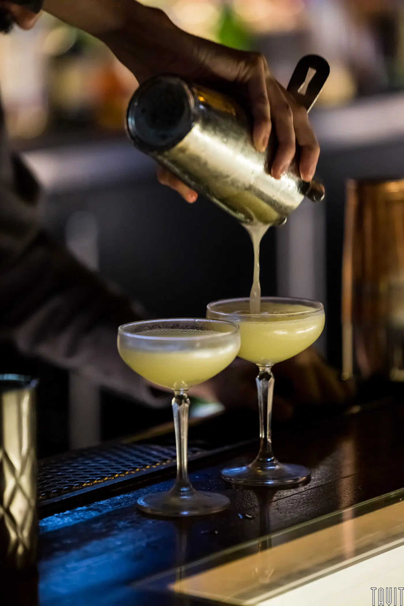 Bartender pouring cocktails