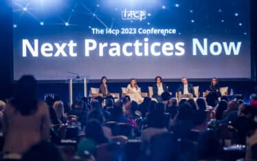 discussion panel on stage at the i4cp 2023 conference