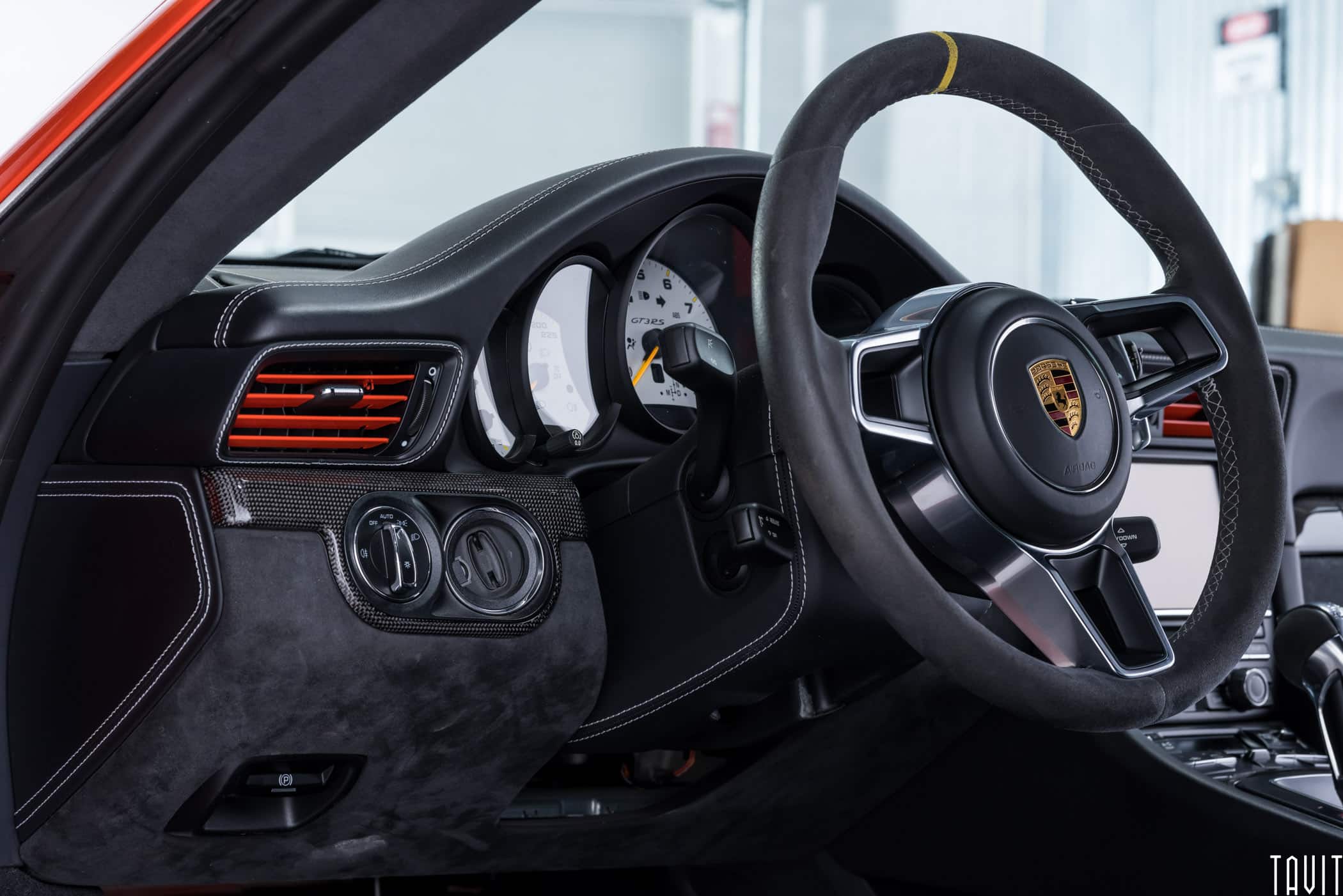 professional interior shot of porche steering wheel