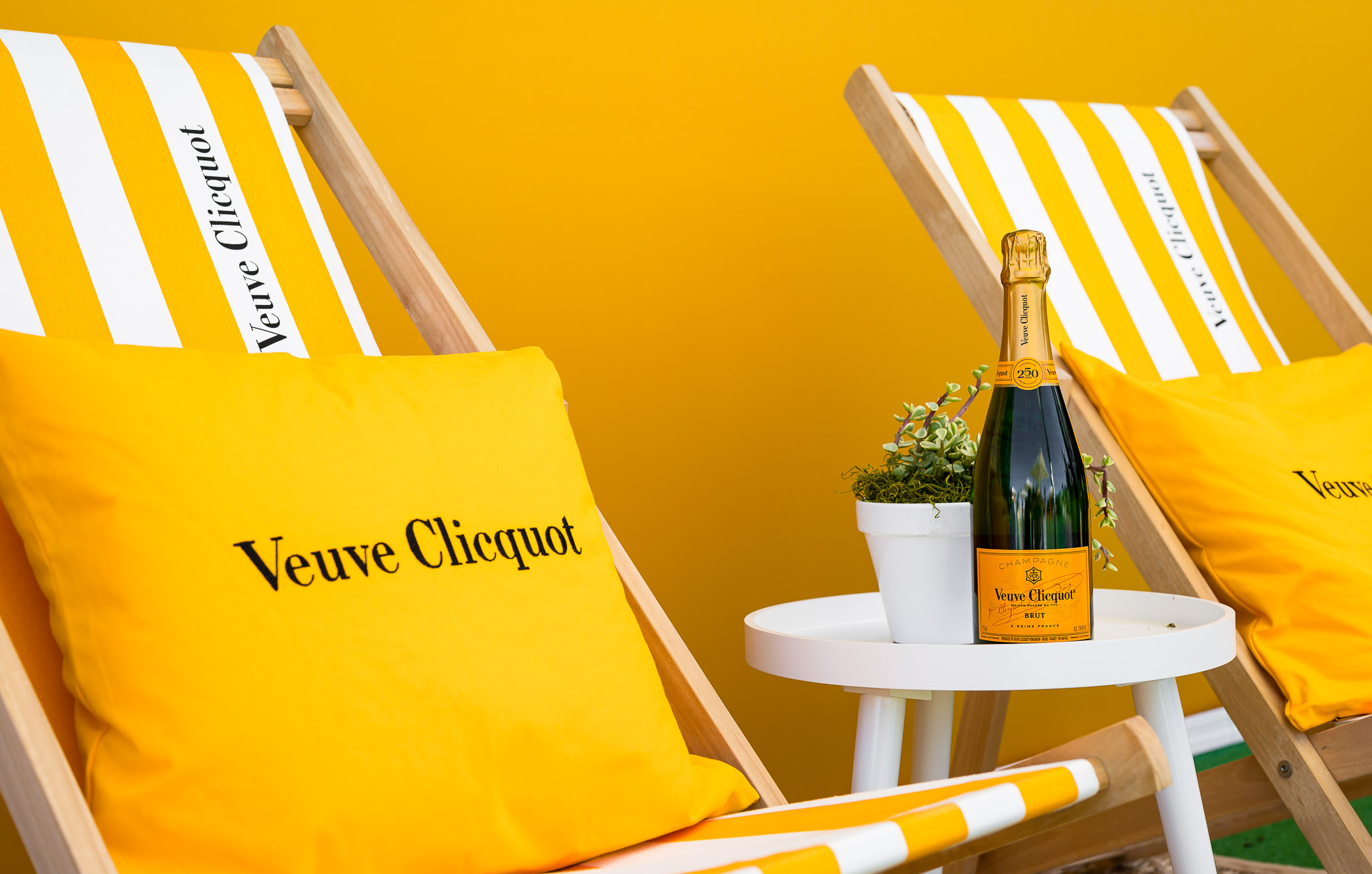 Veuve Clicquot display with chairs and pillows