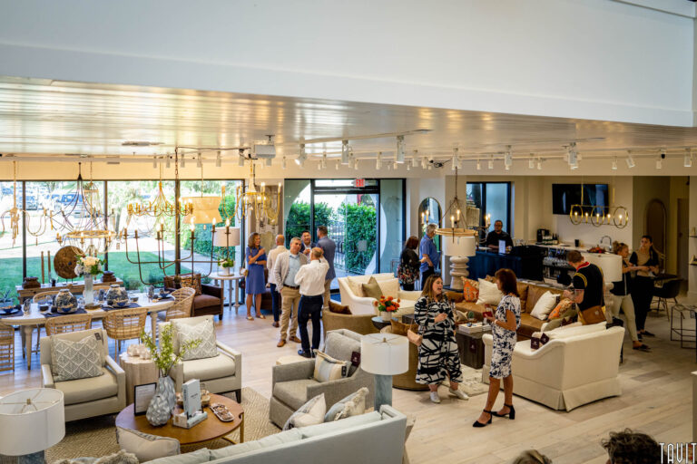 People mingling inside furniture display area