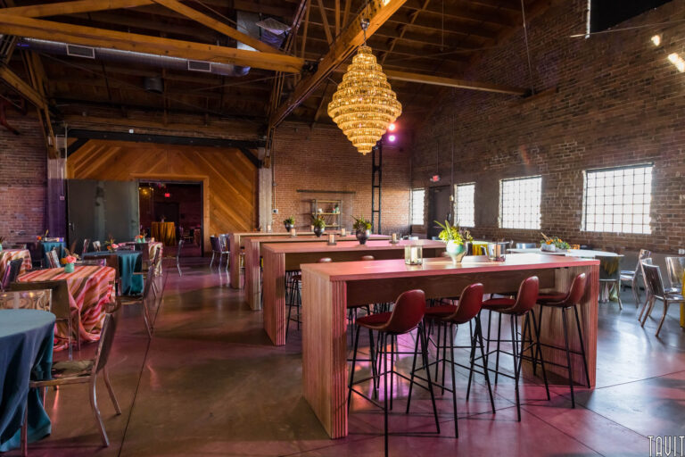 Banquette tables and chairs inside brick building