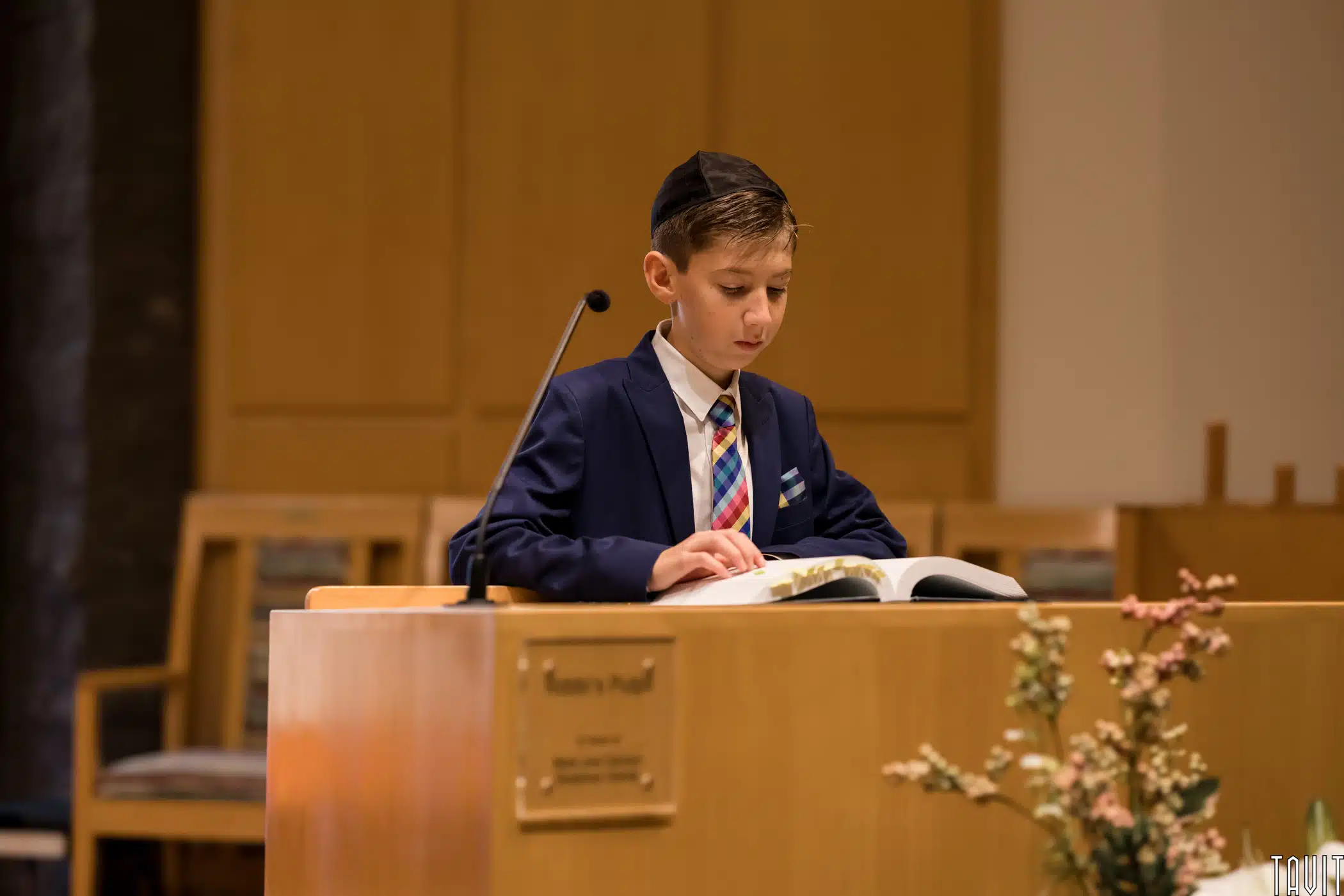 young man reading from the Torah at his Bar Mitzvah
